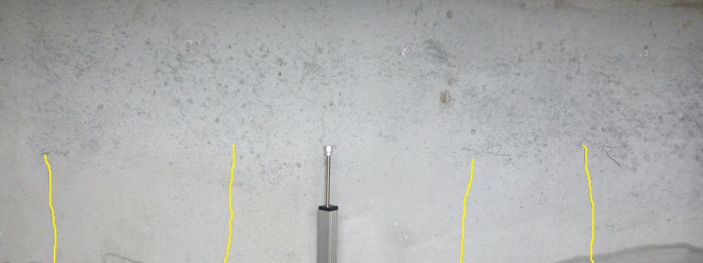 25 mm wide, while there were eight cracks approximately 0.1 0.15 mm wide in the model (Figure 9). Crack pattern at the theoretical ULS is in the Figure 10, the widest cracks had 0.2 mm.