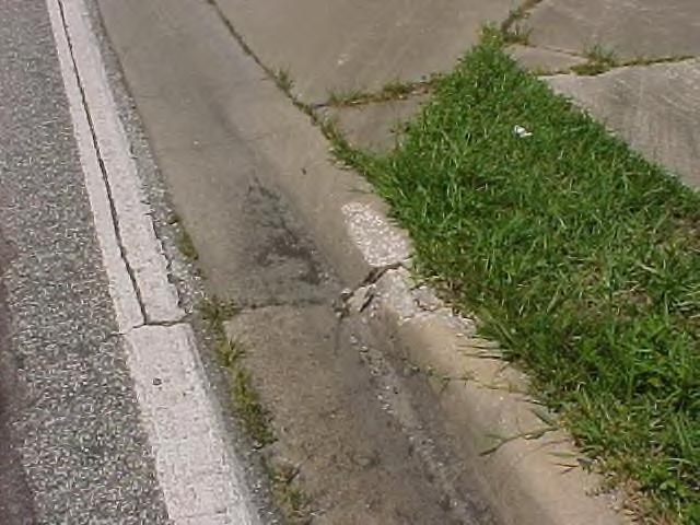 drainage structures that are used to enhance or control the flow of runoff or storm drain water, but does not include curb and gutter, retention/detention ponds or siltation devices.