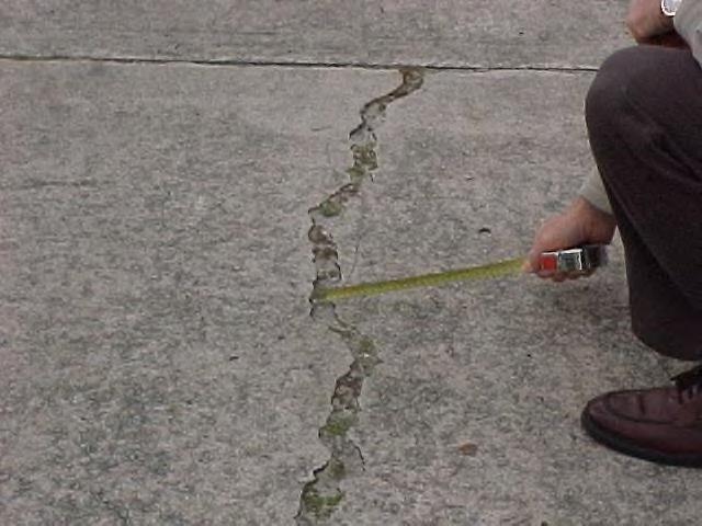 RIGID CRACKING: 90% of the roadway slabs have no unsealed cracks wider than 1/8 inch. Rigid Cracking A slab is defined as that area within the existing control joints.