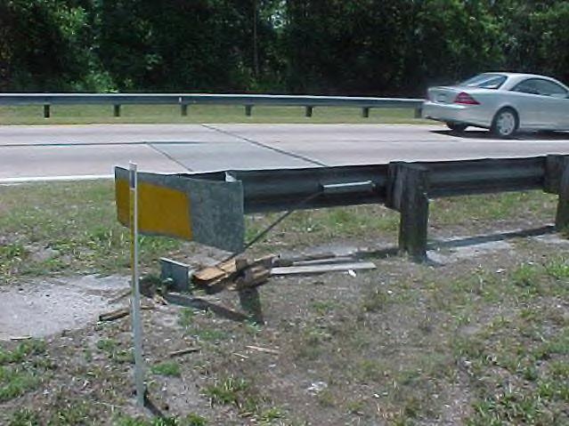 This guardrail has minor damage to the rail and a missing offset block.
