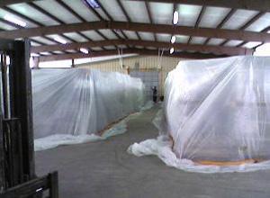 Multiple tarps can be joined by overlapping the adjoining edges by at least 12 inches and fastening them with clamps spaced not more than 12 inches apart.