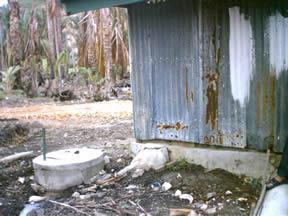 Example: Water & Sanitation Activities Goal: Improve/preserve public health & quality of life Around the back of the latrine.