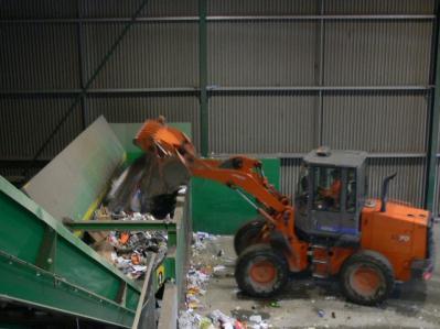 Materials are generally delivered to a single point and transferred to a conveyor system in preparation for sorting.