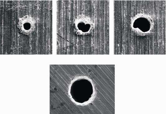The holes are conical with a taper of less than 1.2. The thickness of the recast layer is less than 70 µm.