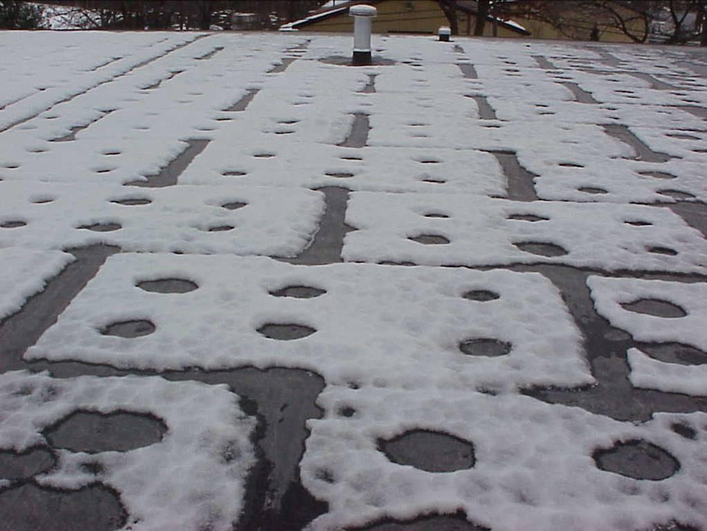 Figure 23 below shows a 2001 Company roof where snow melt occurred over insulation joints from convection air currents and thermal transmission from