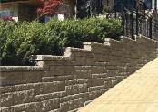 Mulch or Soil Building Step Downs Walls with step downs can be easily finished by adding a AB Lite Stone, or turning the ends back into the hillside.