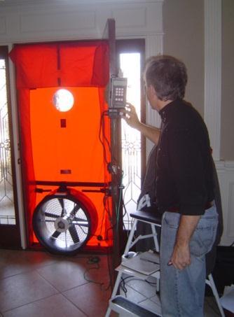 Using a blower door apparatus, shown in Figure 5, the air leakage of each home was measured, and recorded as the number of building air changes per hour (ACH) at a 50 Pascal (0.
