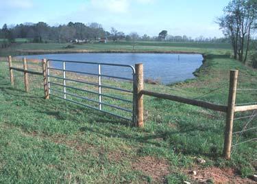 Fenced stream crossings allow animals to get to pasture on both sides of the stream. Concrete or stone on the stream banks helps control erosion. Photo courtesy of USDA NRCS Figure 4.
