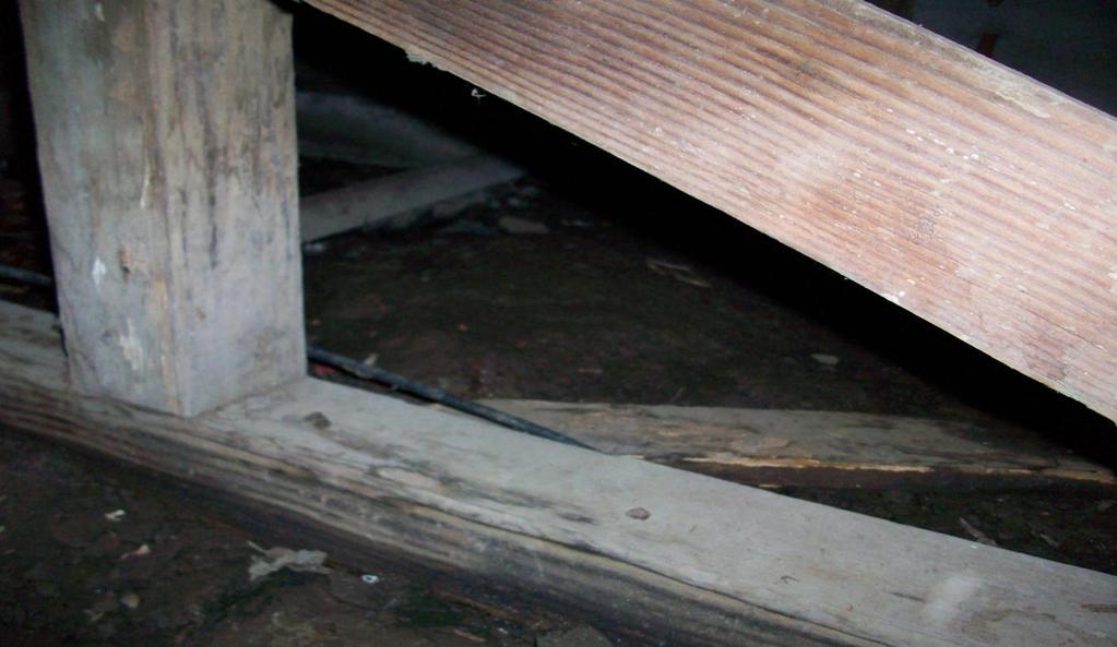 2. There is earth to wood contact under house in the area of the utility room.