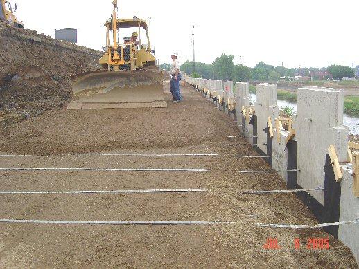 SS 840 Construction SGB placed and compacted in a manner that places the soil reinforcement in tension.