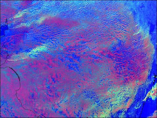 Pollution plumes This false-color image over Australia, produced using NOAA AVHRR data, shows where pollution from human industry reduced clouds' particle sizes.