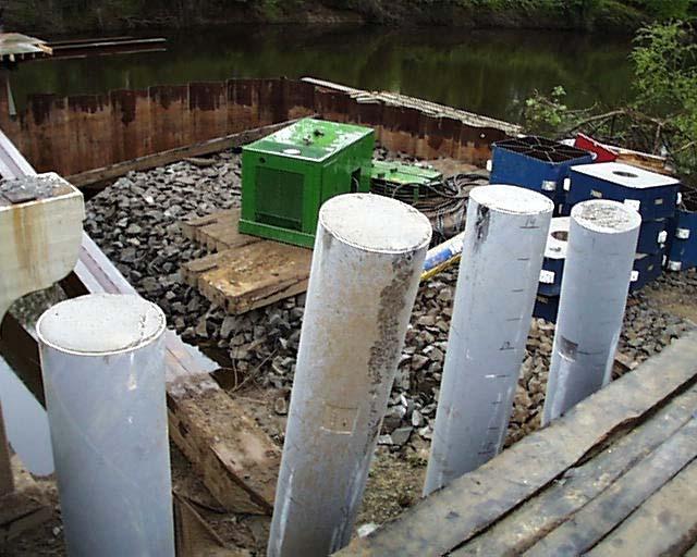 a) Photograph of composite piles installed at Pier No.