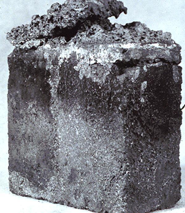 Figure 18: 90% MgO Burned Impregnated Brick After Service in a BOF Bottom Plug The hot face region of the brick is shown in Figure 19 at low magnification.