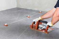 To ensure the tile is completely bonded and that all the air has come out, go over the surface of the
