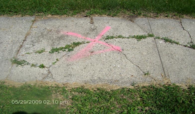 E. SPALLING OVER LESS THAN FIFTY PERCENT (50%) OF A SINGLE SQUARE OF THE SIDEWALK WITH ONE OR MORE DEPRESSIONS EQUAL TO THREE-FOURTHS (3/4) INCH OR MORE. This is the same as indicated above at D.
