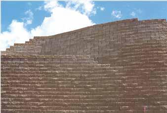 To save money, the wall face is kept short and a steep slope is constructed above the wall, or 2.