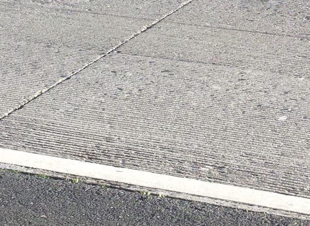 The current pavement on SR 85 consists of longitudinally tined Portland cement concrete.