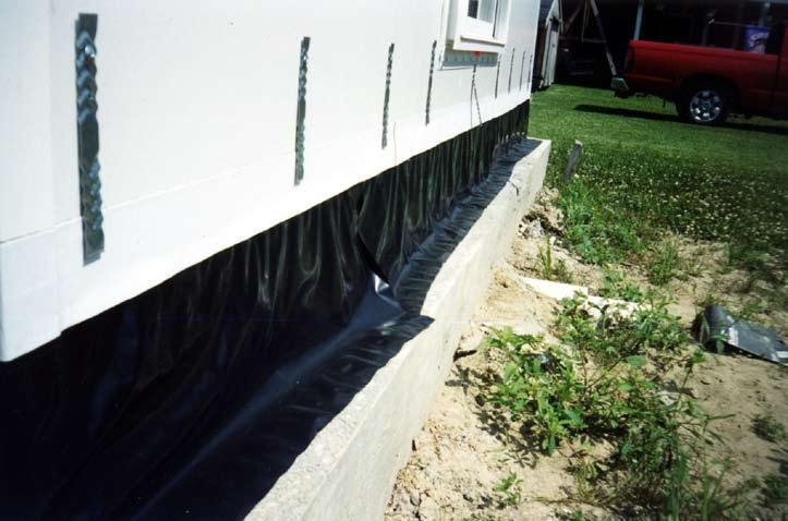 Membrane flashing is applied to walls at