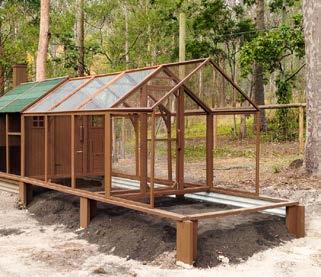 To allow the chickens to be safe from predators, and still have access to fresh grass and dirt, David poured concrete just around the