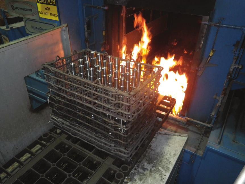 As an example, Fig. 3, 4 show two production loads processed in the above integral quench furnace. The first load consists of long shafts of 51 mm diameter and 660 mm length made of AISI 1040 steel.