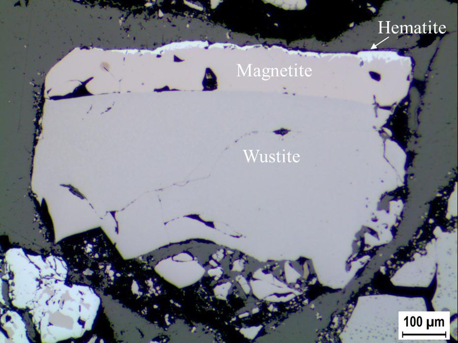 Figure 3. Optical microscope image of a typical mill scale particle showing the presence of the three iron oxides wustite, magnetite and hematite. 3.2 