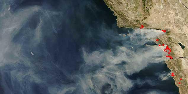 Smoke from massive wild fires across southern California out over the Pacific Ocean Air pollutant natural sources include: Wind picking
