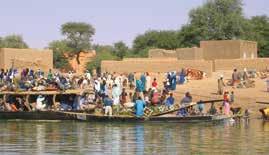 Along the Niger s course, Canoes designed for carrying passengers from one side of the river to the other near