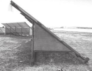 Units are designed to lift and carry from the side or tow from an end. Figure 9. This slanted wall design has a railing on the back so young animals can be bedded underneath.