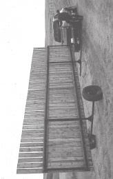 When lifted from the side to be moved from one field to another, gates must be wider than the length of the portable windbreak, or lift must be higher than the fence. B.