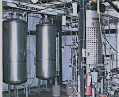 Gasification followed by biocatalyst fermentation and distillation