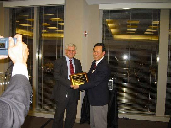 Ho presenting an appreciation plaque to Hobson at CACS banquet Picture by Dr.