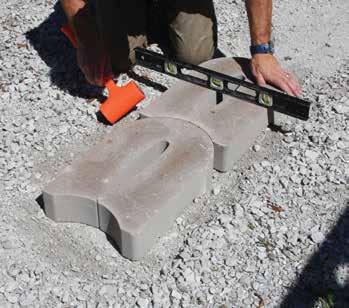 grade. Then place a dense graded aggregate and compact to 95% standard density or modified.