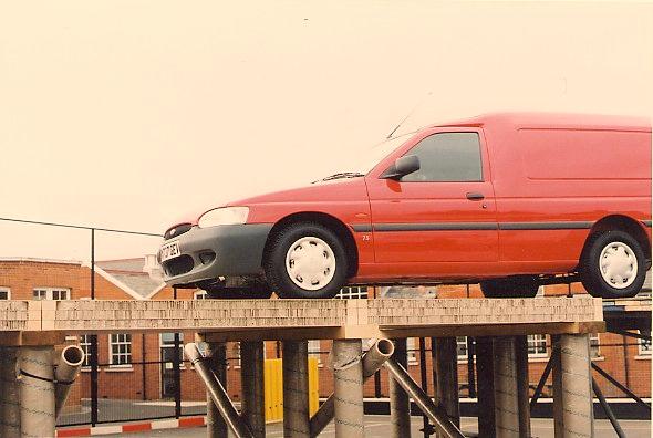 Figure 3: Car on cardboard bridge 3. THE PROBLEMS OF BUILDING WITH CARDBOARD The reader of the previous section may emerge wondering why cardboard isn t being used everywhere already!