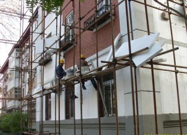 Figure 4. Two Workers Install Insulation in a Typical Chinese Residential Building Source: CABR Figure 5.
