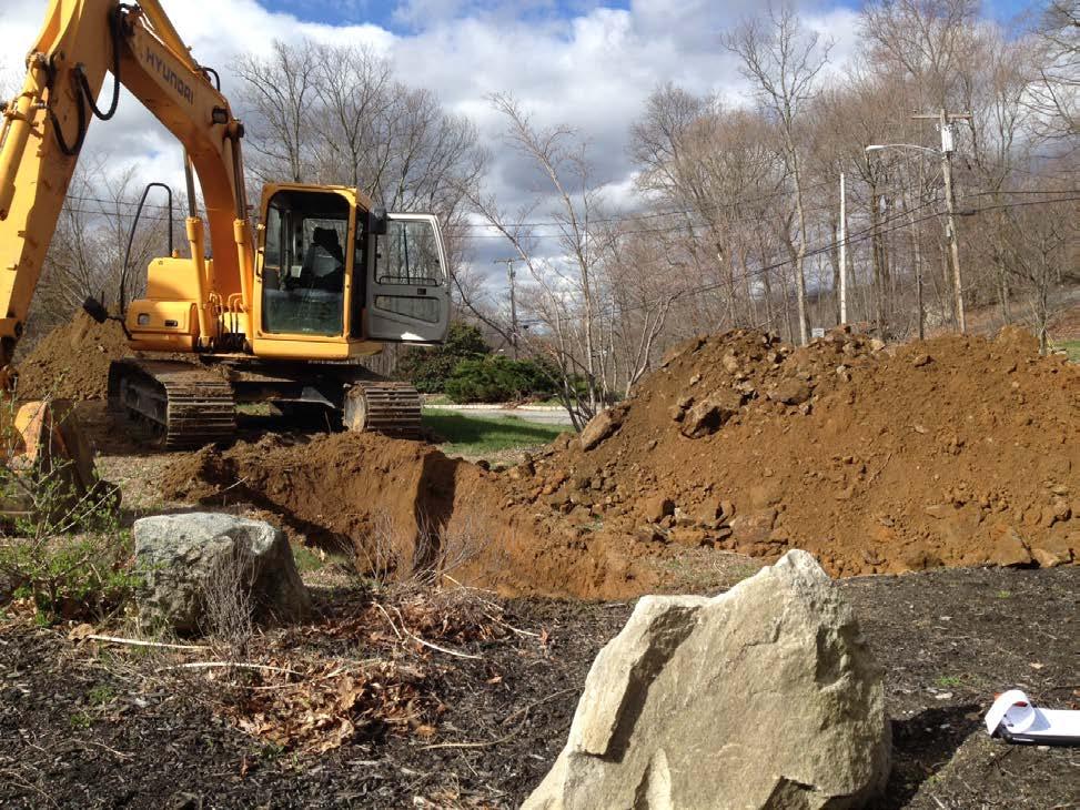 When excavating in rock, a larger backhoe, such as the one pictured below is often necessary: Determination of Groundwater Level: One of the most important determinations in soil investigations is