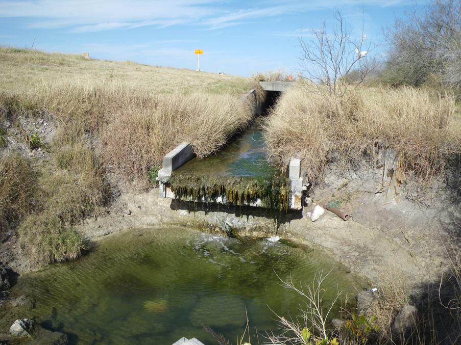 OCB054 OCB054 is located where TX-286 crosses over the Oso Creek. There is a cement drain that empties into a ditch that leads to the Oso Creek.
