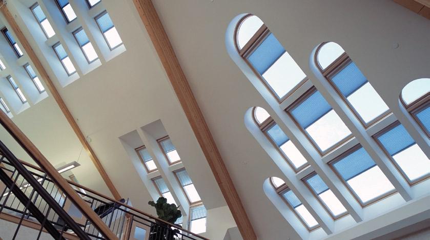 Daylighting through sloped roofs Toplighting through the sloped roof is ideal for achieving optimal light distribution throughout a space, for reducing or eliminating glare issues, and for maximizing