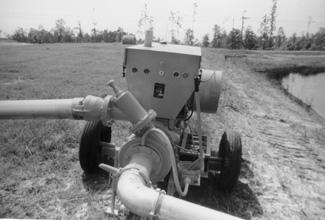 Figure 15. Diesel powered pumping unit on pond The most important factor in selecting an electric motor or internal combustion engine to supply irrigation water is horsepower.