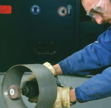 GRINDING AND DEBURRING FLAP WHEELS WITH SPINDLE Flap wheels are made of abrasive cloth flaps glued onto bakelite fulcrums and designed to give a constant finish and a uniform cutting speed for
