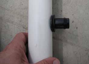 Take one of the prepared sections of pvc and install a 111598 grommet in the hole. 5.
