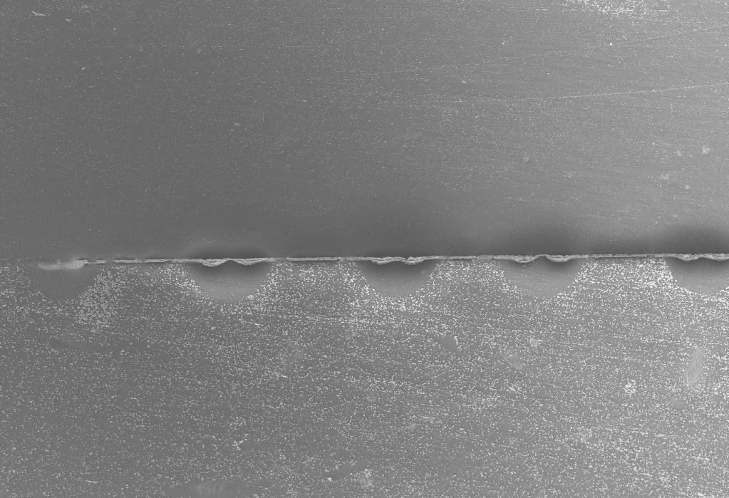 23 20 µm Figure 2-3: Successful cross-section of a row of LFCs and junction delineation between the p-type melt regions and the n-type substrate, sample passivated with a-si:h/sio x.