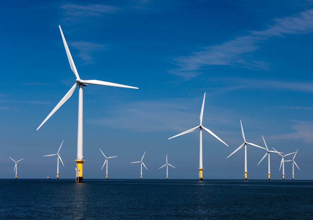 Figure 1: Photographs of modern onshore and offshore wind farms.