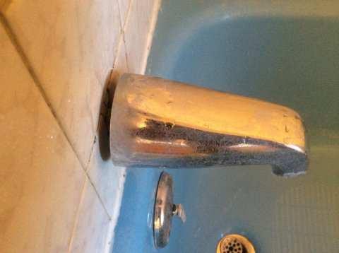 Recommend sealing the gap between the tub faucet and shower wall to stop