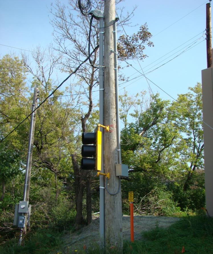 All electrical cables and conductors installed above ground, except where attached to