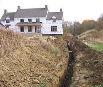 Geothermal lines are trenched from a lake loop into a home. Heating is accomplished with no fumes, gases or flames during its operation, thus keeping it clean and safe at all times.