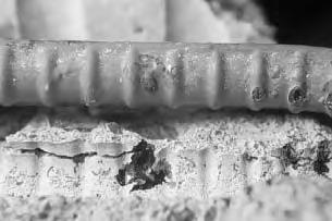 Figure 3.24 Blisters always formed adjacent to concrete voids. Blisters were formed because of the increase in volume of the corrosion products in the vicinity of coating defects.