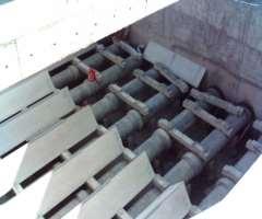 Distribution pipes with deflectors of Pulsator clarifier The water then flows upward through sludge blanket and the clarified water is collected by