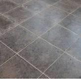 ASPHALT TILES 3) BITUMASTIC FLOORING: This is a joint less, low-cost flooring and consists of a type of asphalt rolled onto a solid sub floor in a hot plastic state.