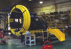 Automatic coiling systems for larger diameter flexible and semi-rigid products {typically 50mm to 200mm diameter smooth walled pipe, composite pipes, flow-lines and pre-insulated