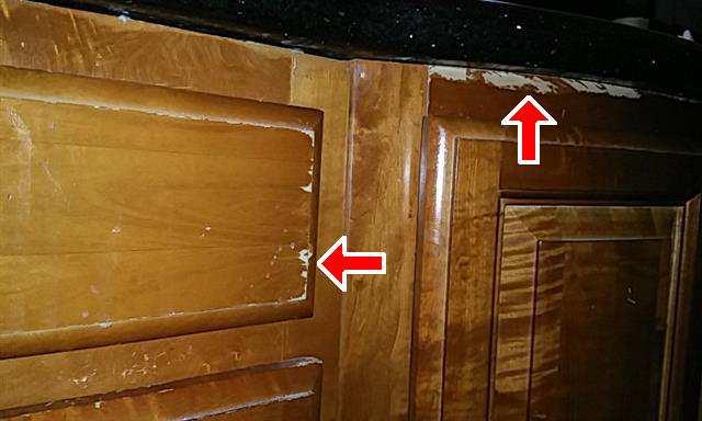 Replace The finish is worn at some cabinets and excessive moisture has
